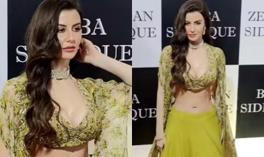 Giorgia Andriani stuns in a green lehenga with a deep neck choli and a long floral cape at Baba Siddiqui`s annual Iftar party