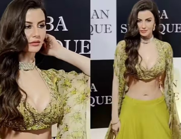 Giorgia Andriani stuns in a green lehenga with a deep neck choli and a long floral cape at Baba Siddiqui`s annual Iftar party