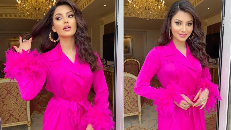 Urvashi Rautela Radiates Charm in Elegant Silk Feather Fuchsia Pink Dress