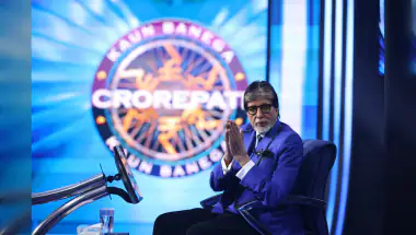 Amitabh Bachchan Watches Late Matches with Headphones